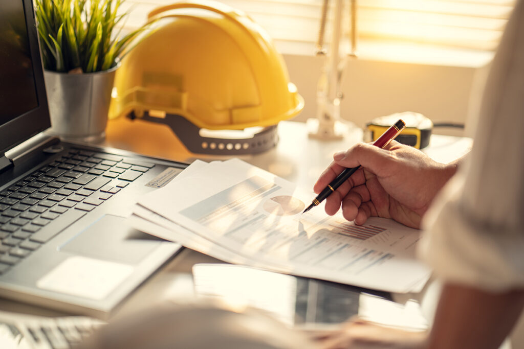 Hand Of Business People Working Document About Budget Profits An